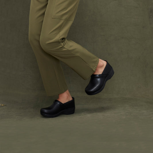 Classic black clogs shown on foot.