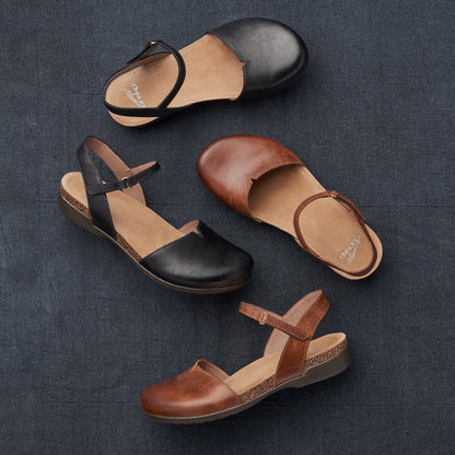 A closed-toe sandal style shown in two waxy leather options.